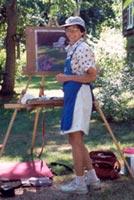 Joan Ledwith paints a large pastel painting on her Take It Easel en plein air.  The Take It Easel supports her artwork and all her art supplies.